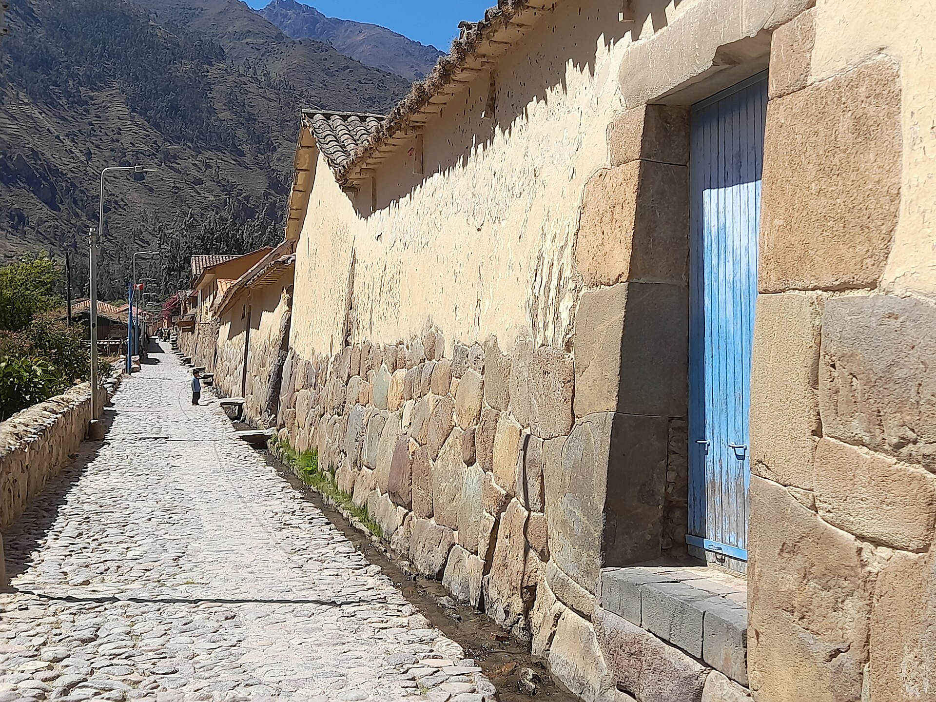 A stone-lined street in Ollantaytambo, Peru