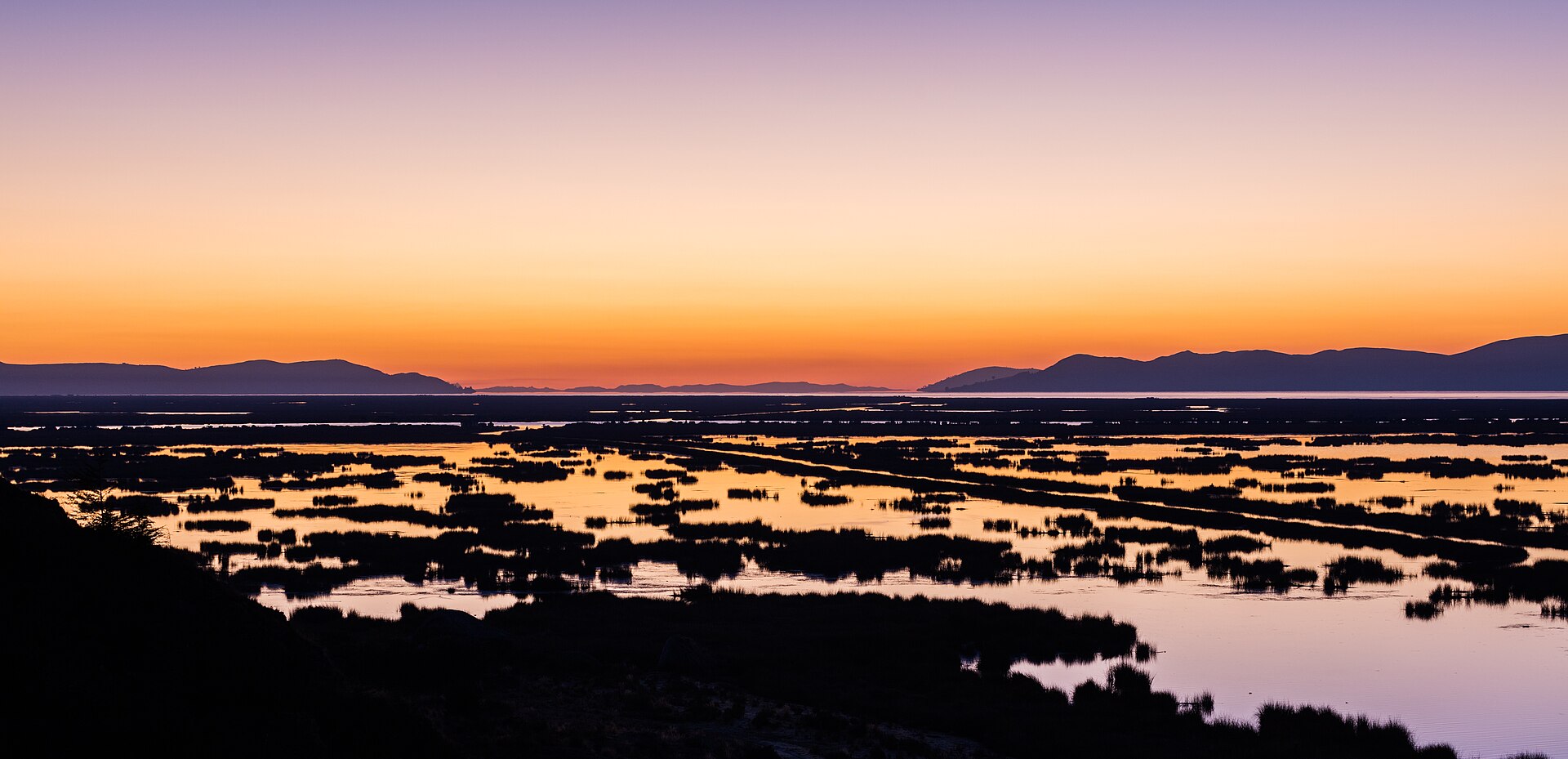 Sunrise over Lake Titicaca near Puno in the Peruvian Andes