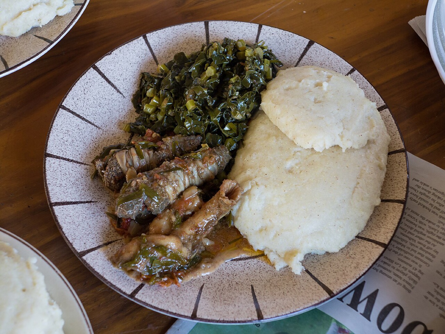 Sadza with greens and meat, a Zimbabwean meal