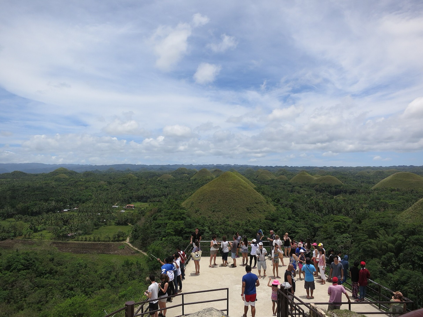 Visitors overlooking the Chocolate Hills in Bohol, Philippines