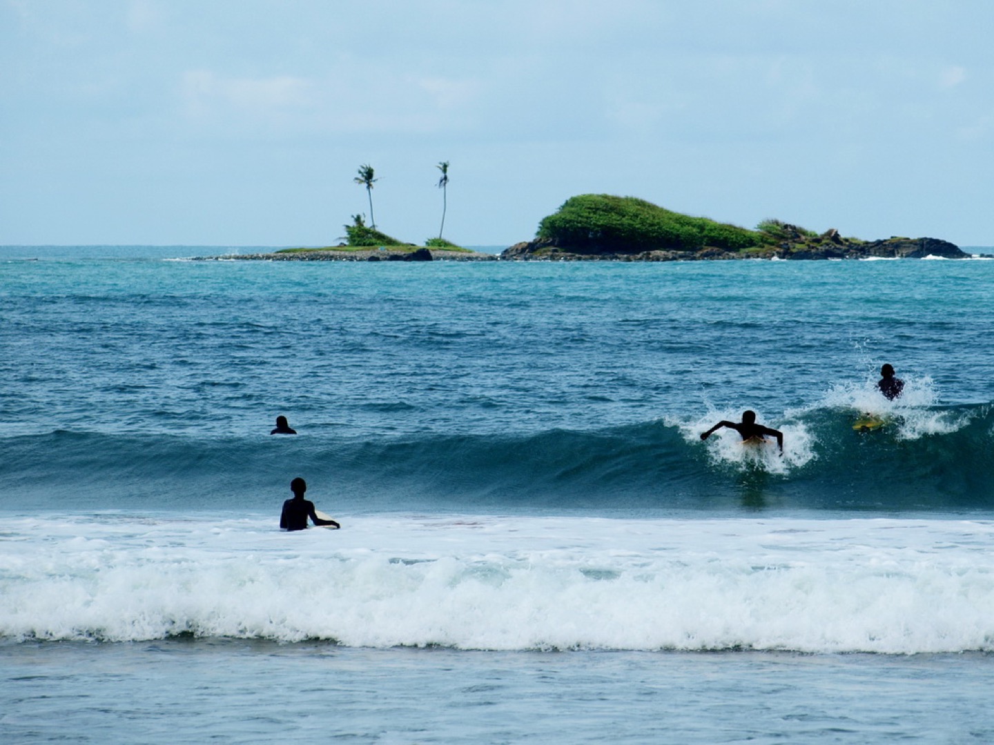 Surfers at Busua Beach in western Ghana