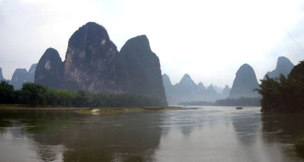 Limestone peaks reflected in the Li River near Xingping