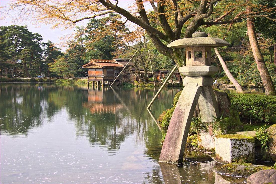 The two-legged Kotoji stone lantern standing in a pond in Kenroku-en