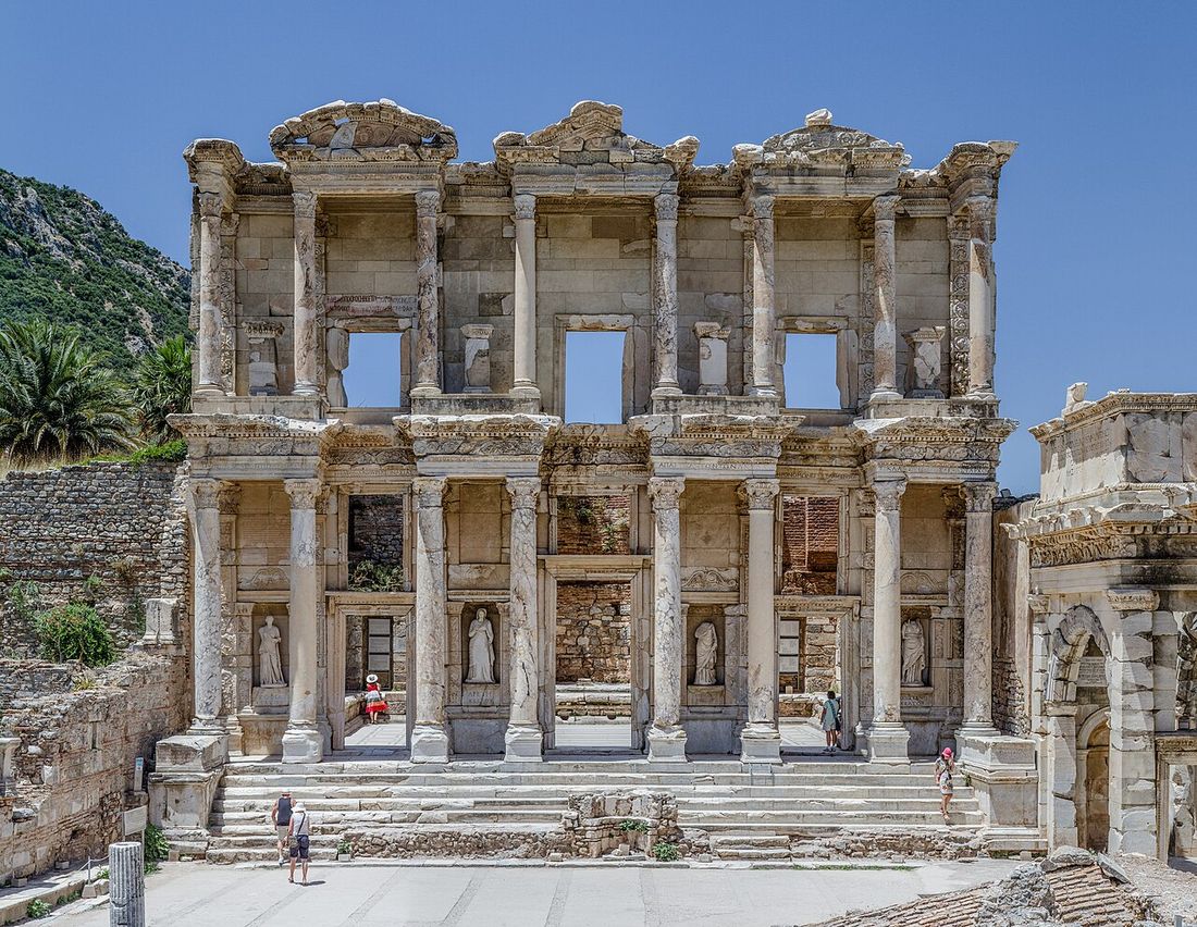 The two-story marble facade of the Library of Celsus at Ephesus, with statues set between its columns